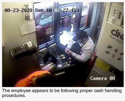 Employee following proper cash handling procedure